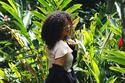 Side view of woman standing on field