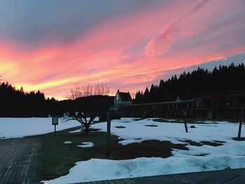 Scenic view of frozen lake against sky during sunset