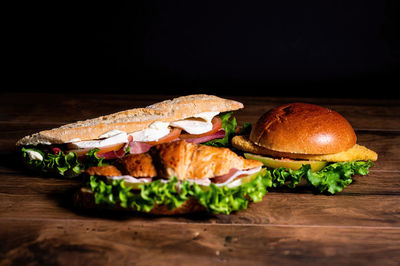 Variety of food on table against black background