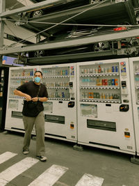 Rear view of man standing in factory