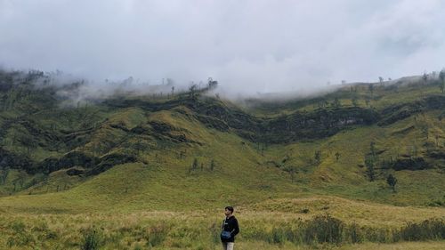 Full length of man on mountain against sky