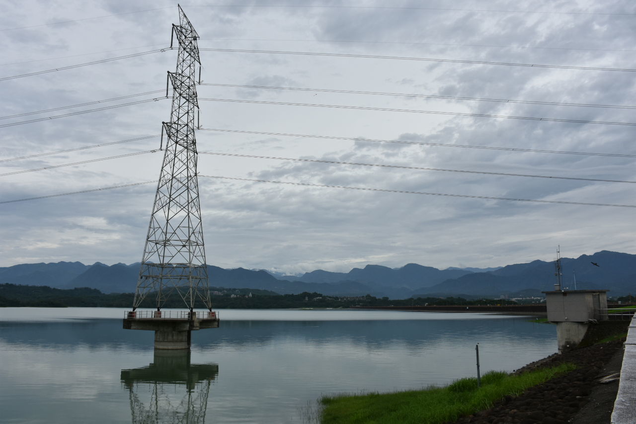 sky, cloud - sky, built structure, water, cable, nature, technology, electricity, architecture, electricity pylon, no people, connection, power line, day, fuel and power generation, beauty in nature, lake, tower, outdoors, power supply, sailboat