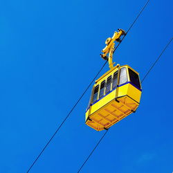 Yellow cableway cabin against sky. rosh hanikra, mediterranean, israel.