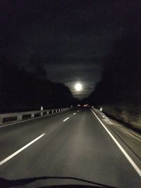 Road in illuminated tunnel