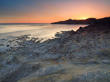 Scenic view of sea at sunset