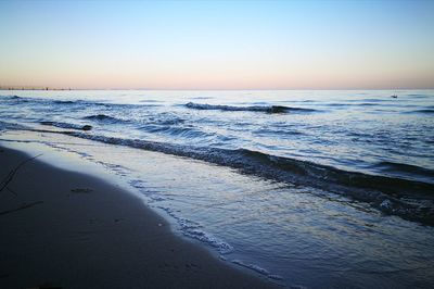 Scenic view of sea against sky at sunset