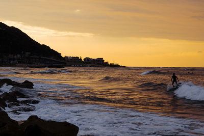 Scenic view of sea against sky during sunset