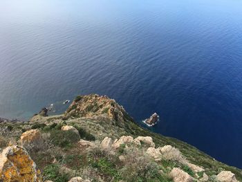 High angle view of rocks by sea