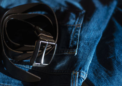 Beautiful leather belt and jeans close-up