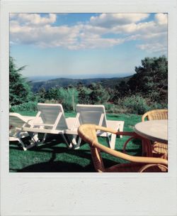 Empty chairs against the sky