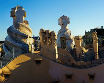 Low angle view of built structure against clear blue sky