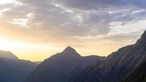 Scenic view of mountains against sky during sunset