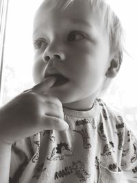 Close-up portrait of cute boy looking away