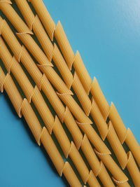 High angle view of pasta against blue background 
