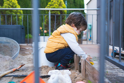 Side view of boy looking at park