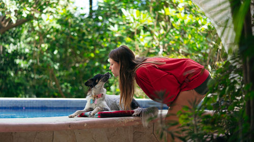 Female owner playing with dog