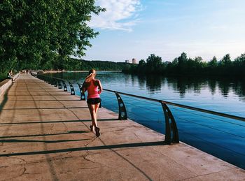 Full length of woman walking in water