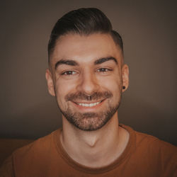 Close-up portrait of smiling young man