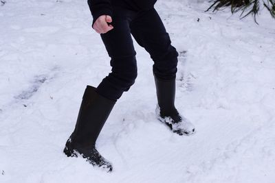 Low section of person on snow field