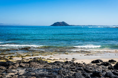 Scenic view of sea against clear sky