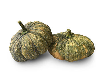 Close-up of pumpkins against white background