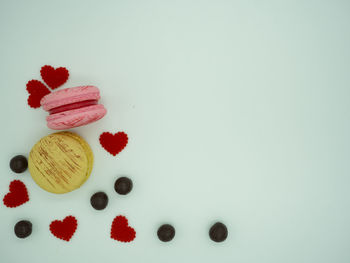 Close-up of cake on table against white background