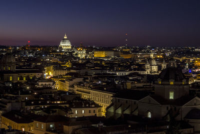 High angle view of illuminated buildings in city at night