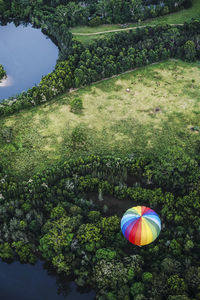 High angle view of multi colored umbrella against trees