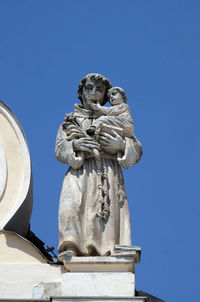 Saint anthony of padua on the top of parish church of saint nicholas in cakovec, croatia