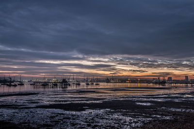 Scenic view of beach against sky during sunset