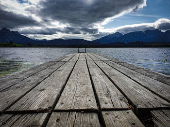 Pier over lake against sky