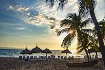 Scenic view of beach against sky during sunset