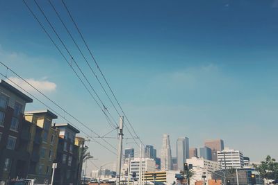 Low angle view of buildings against blue sky