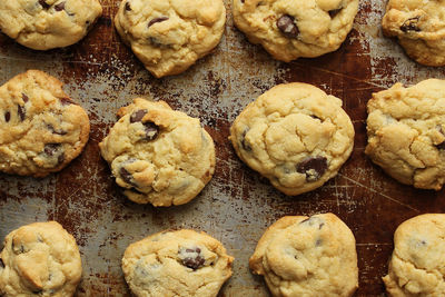 Full frame shot of cookies arranged on rusty tray