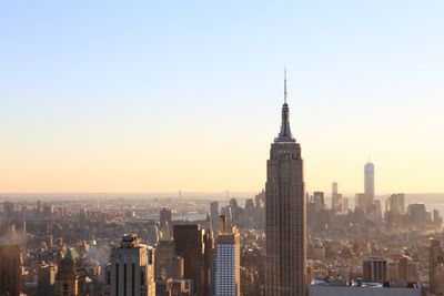 View of buildings in city against clear sky