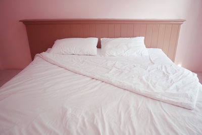 View of empty bed in bedroom