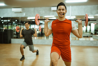 Portrait of man exercising in gym