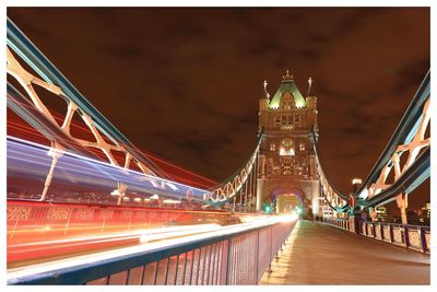 Illuminated suspension bridge at night