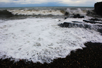 Scenic view of beach against sky