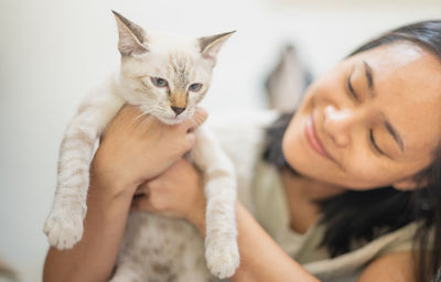 Portrait of woman with cat