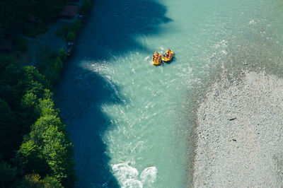 Aerial view of people sailing in river