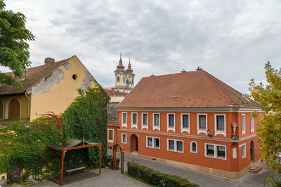 Exterior of houses and buildings against sky