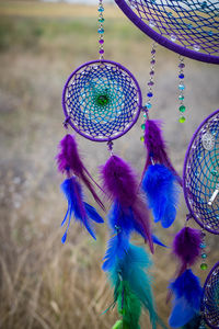 Close-up of dreamcatcher hanging outdoors