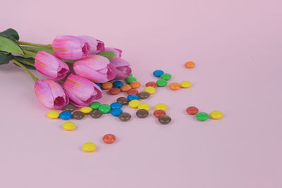 High angle view of multi colored pencils on white background