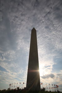 Low angle view of monument against cloudy sky