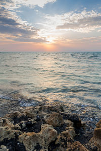 Scenic view of sea against sky during sunset