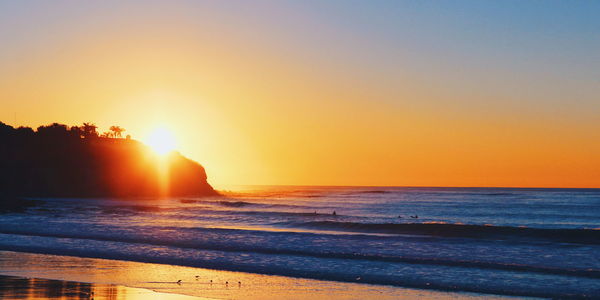 Scenic view of sea at sunset