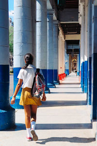 Woman walking in corridor