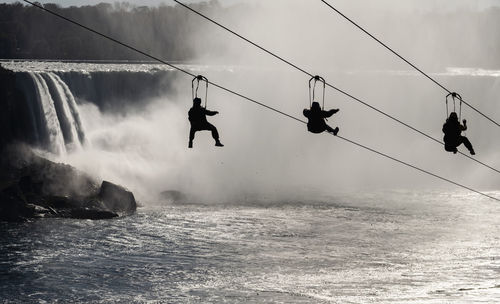 People enjoying a zipline adventure in niagara falls, ontario, canada in the fall.