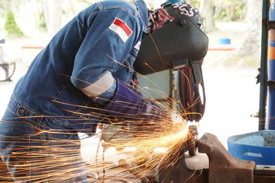 Welder activities at welding shop with beautiful spark. 